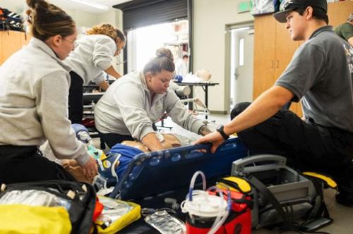 Students gather around in a lab