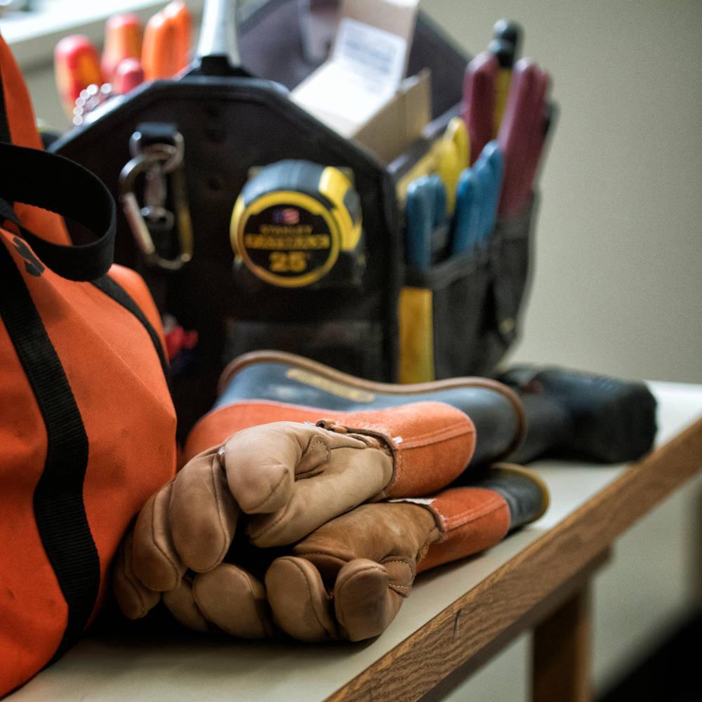 A pair of gloves on a work table.